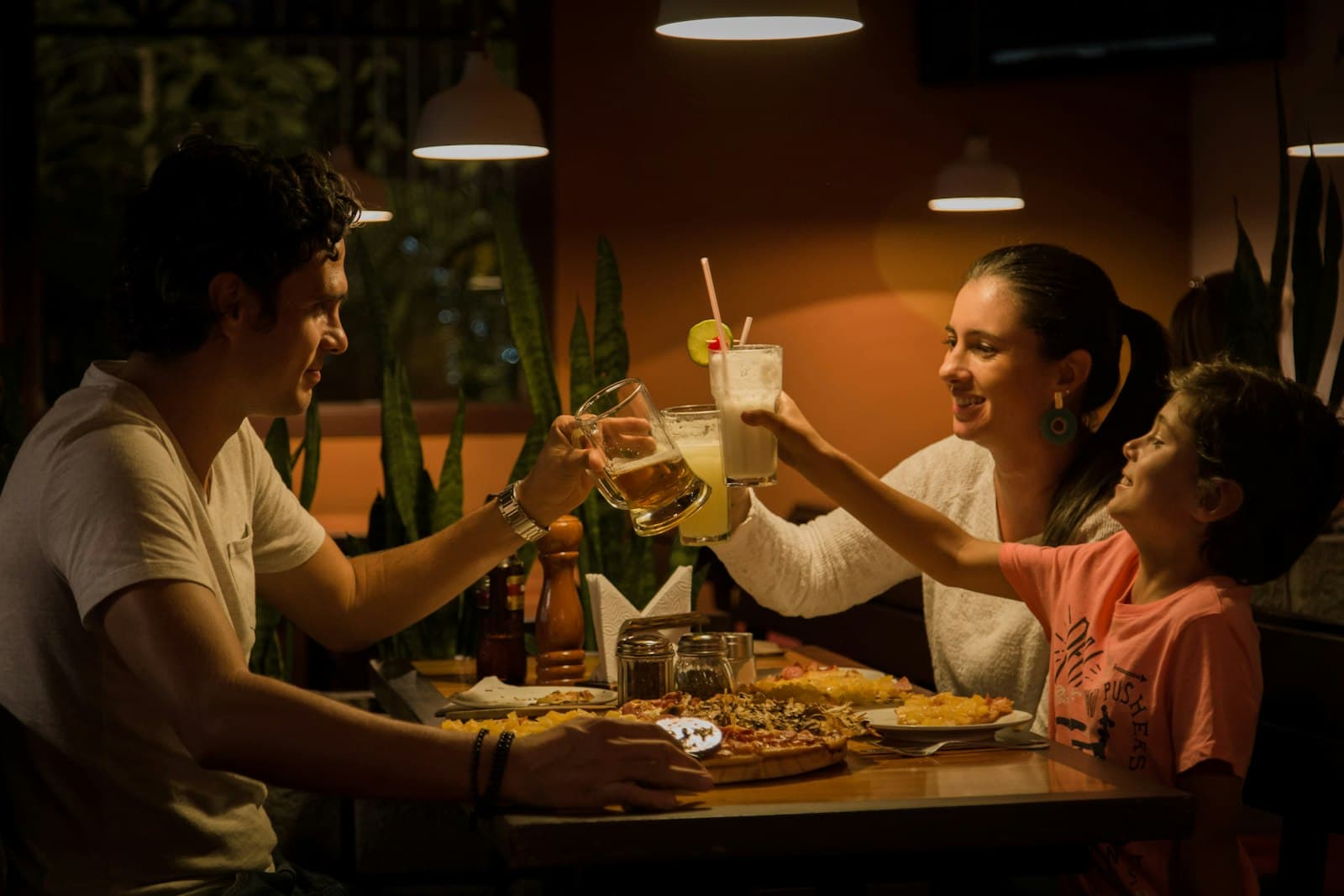 Guests raising a glass at a table